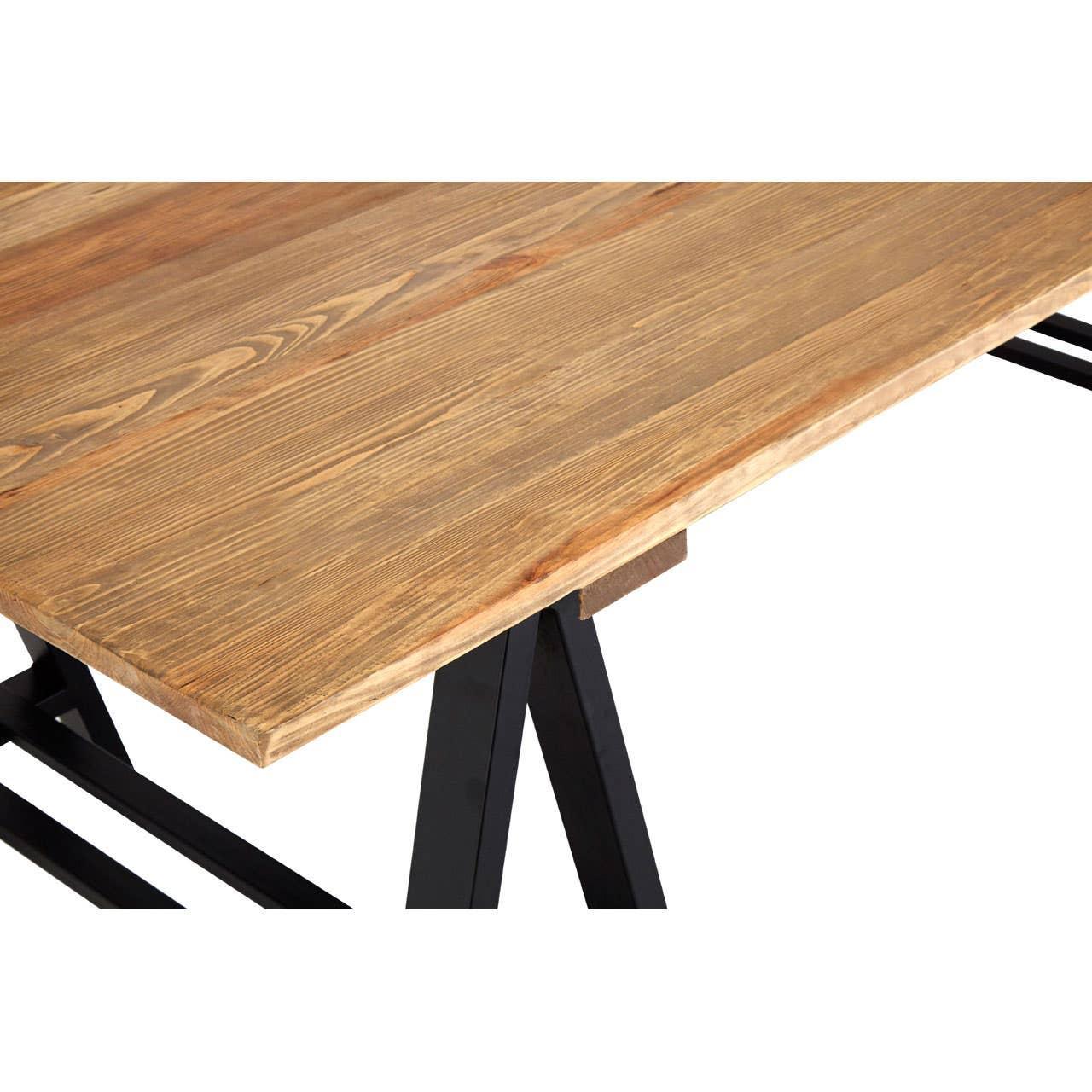 Wood dining table with black metal legs, closeup of natural grain tabletop corner