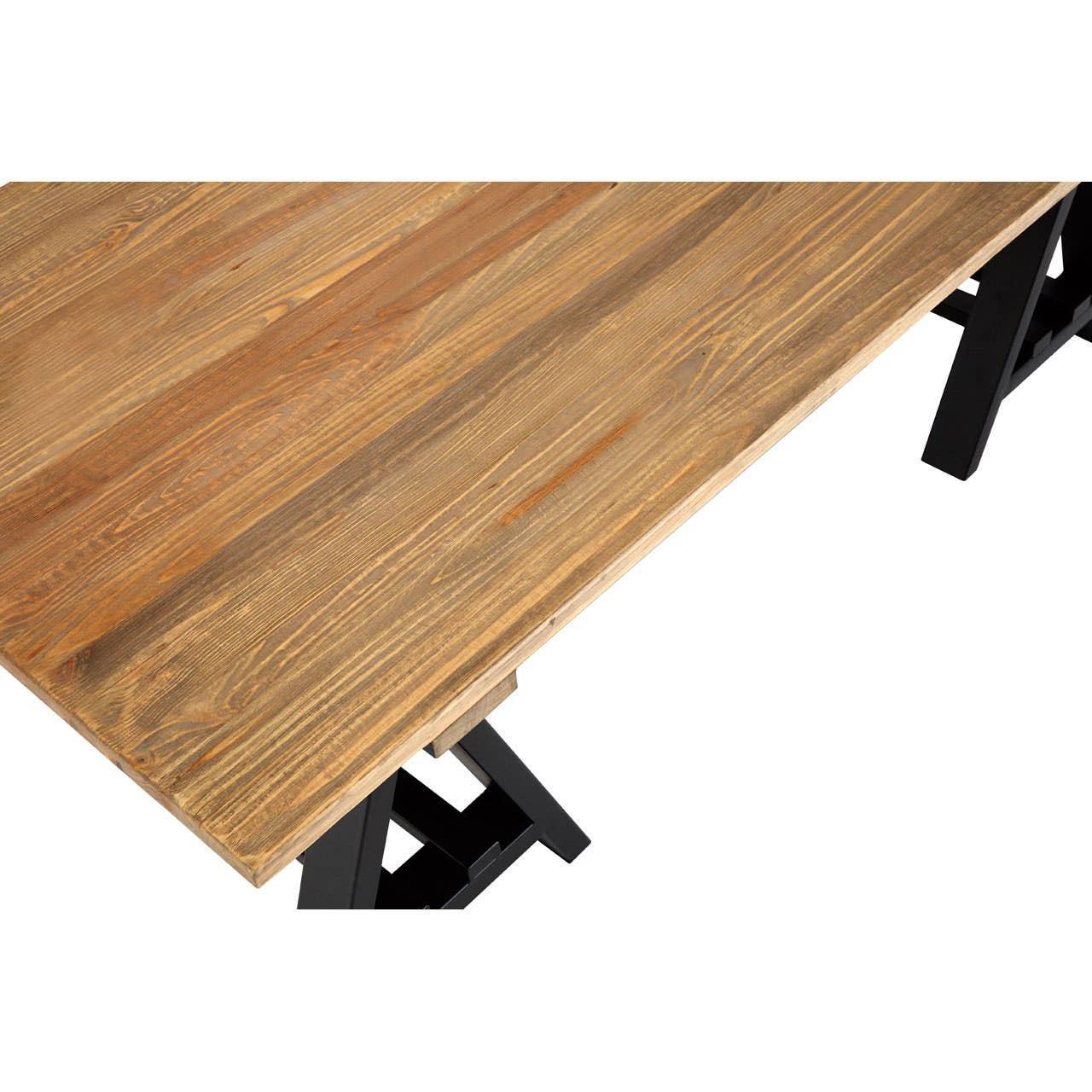 Rectangular wooden dining table with natural wood grain and black trestle legs, angled view