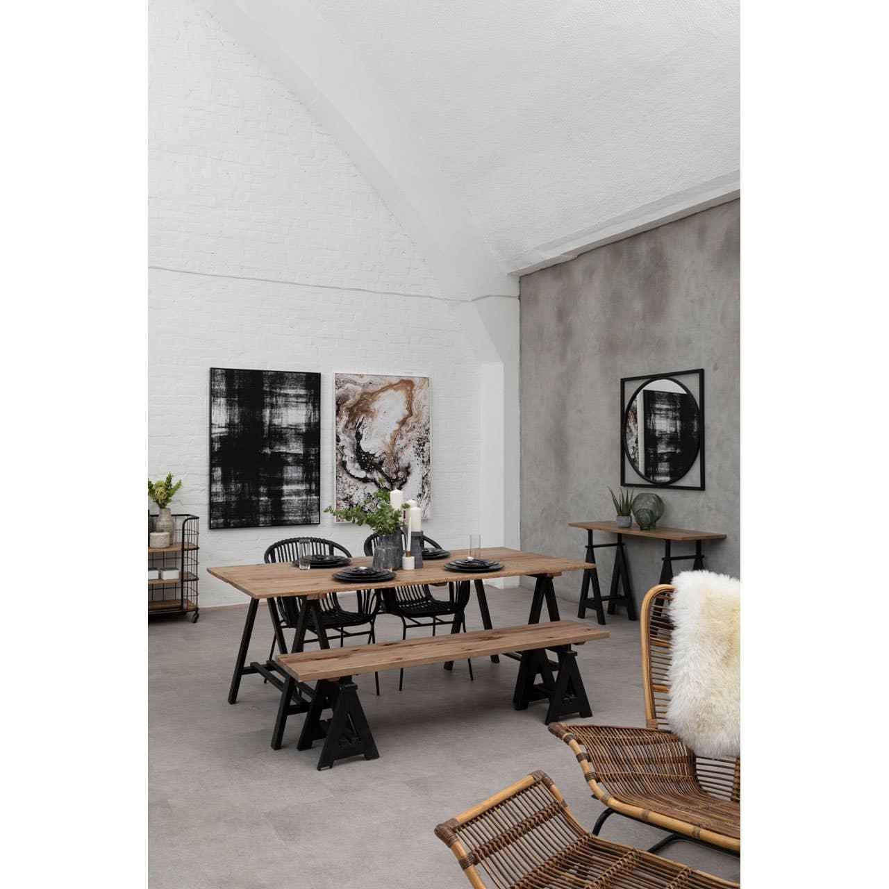 Industrial dining table set with black metal legs, wooden benches and chairs in modern room