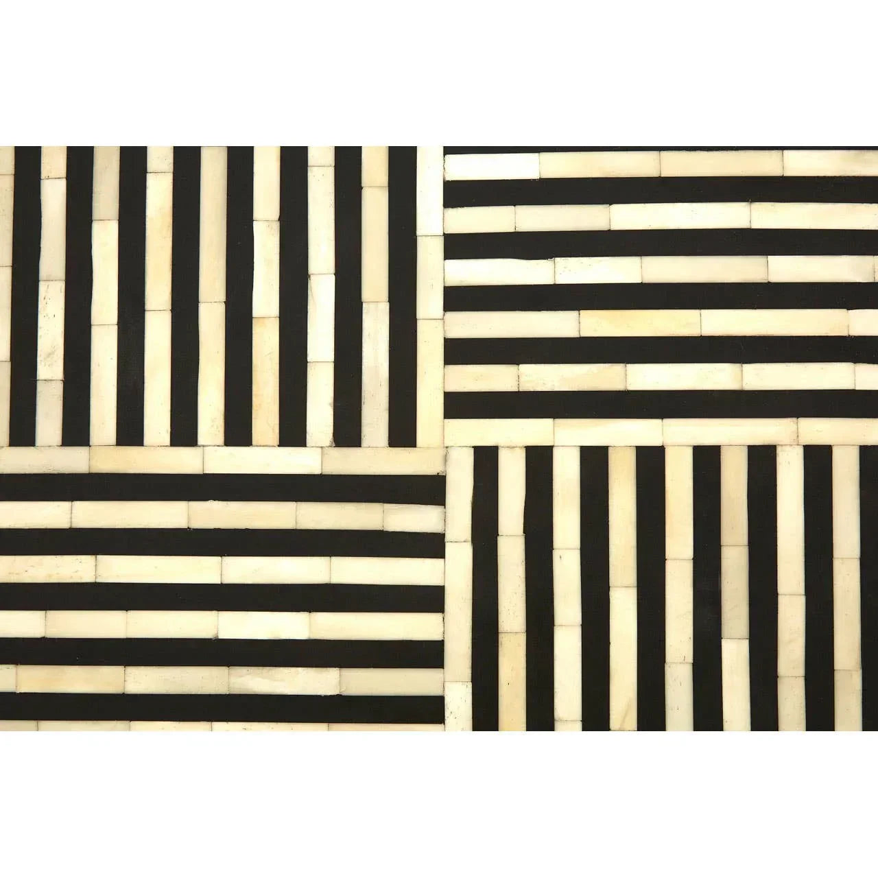 Black and white marble tile surface with geometric striped pattern
