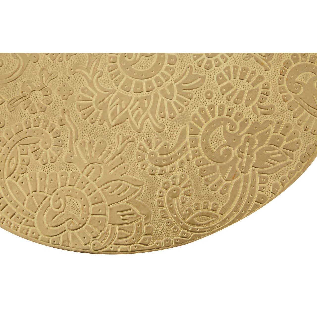 Gold embossed round metal tray with detailed floral pattern close up