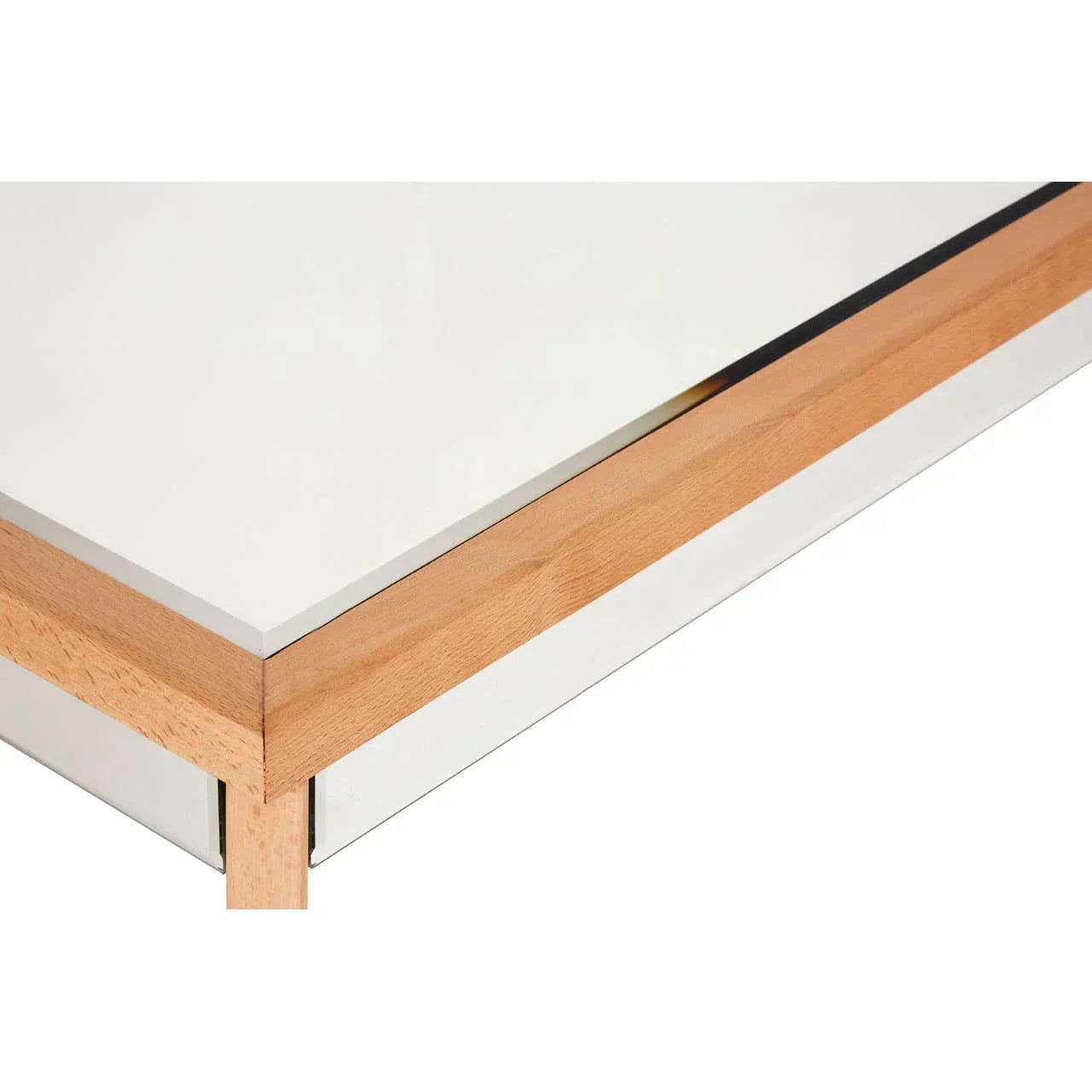 close-up of wooden and glass coffee table corner with chrome trim