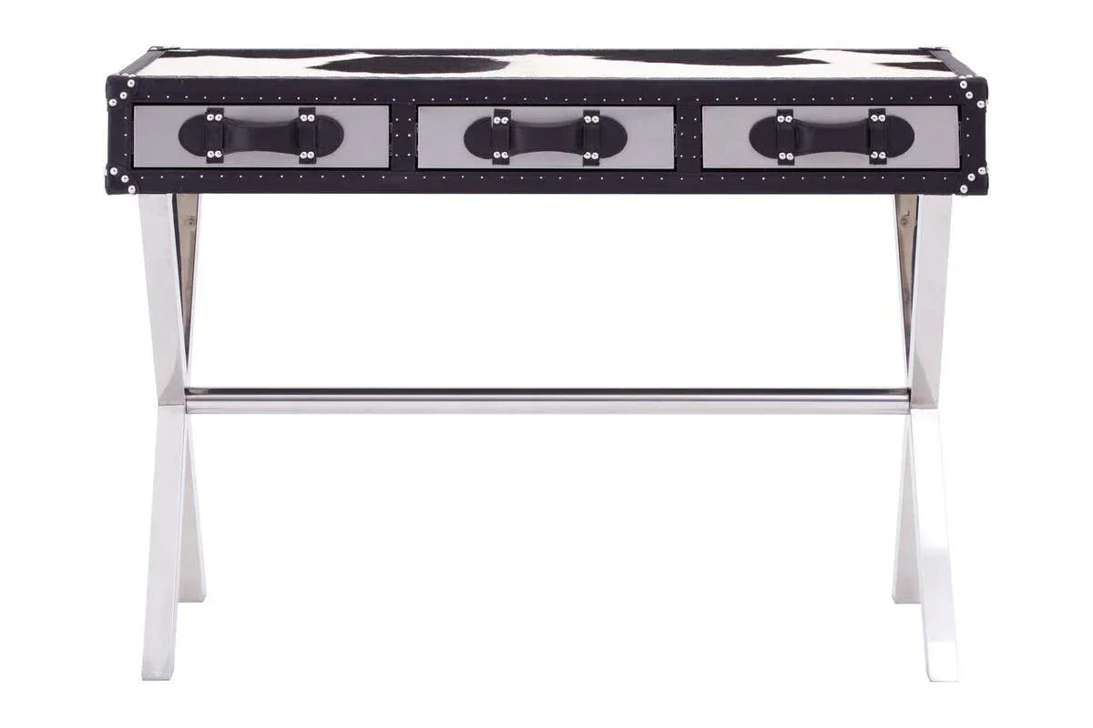 Black and white cowhide desk with chrome legs and three front drawers