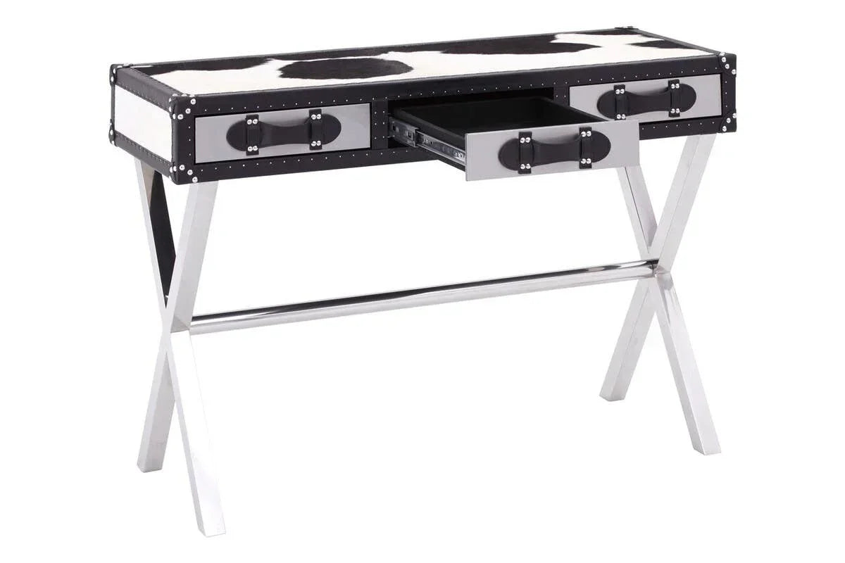 Cowhide desk with chrome X-frame legs and three drawers, one drawer open, angled view