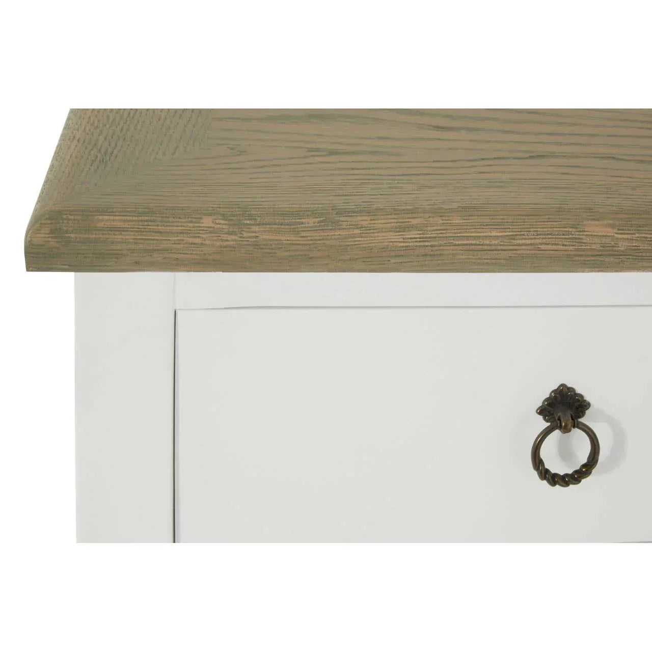 Closeup of oak top storage unit with metal drawer handle and white painted finish