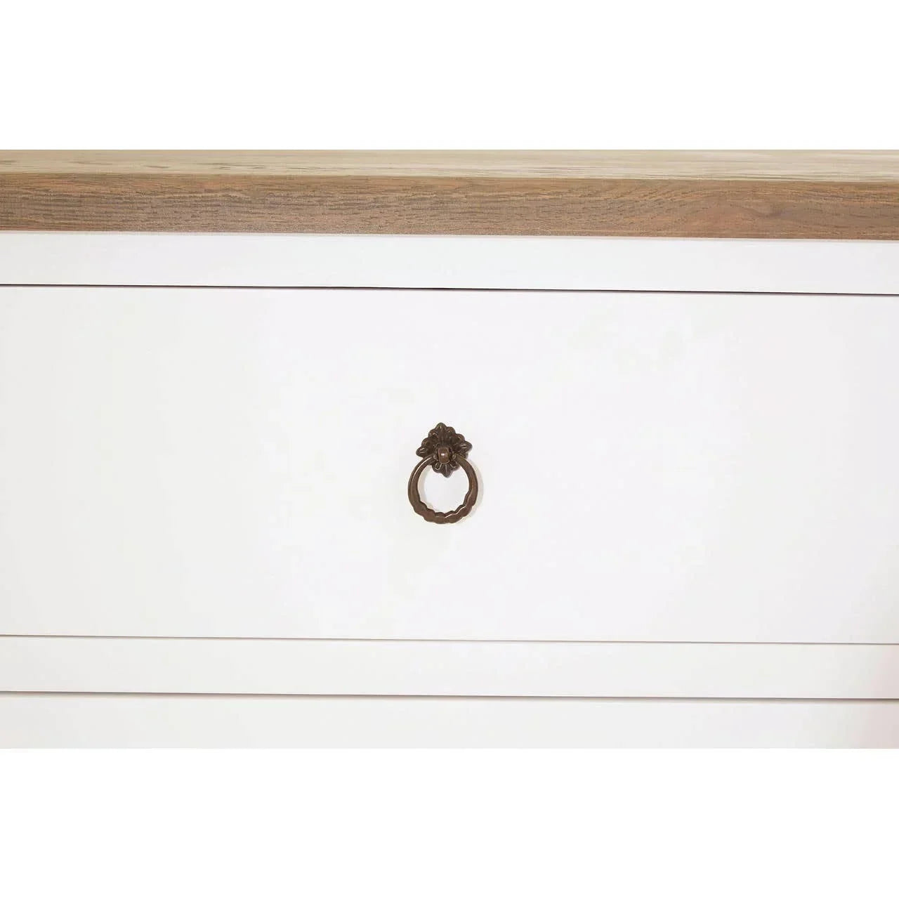 White wooden drawer with brass ring handle and oak top detail