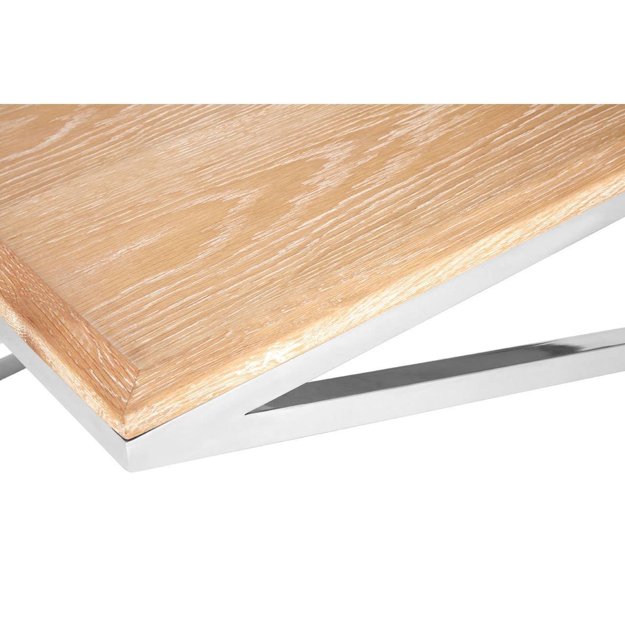 Oak wood table top with chrome metal legs, close-up of contemporary dining table corner