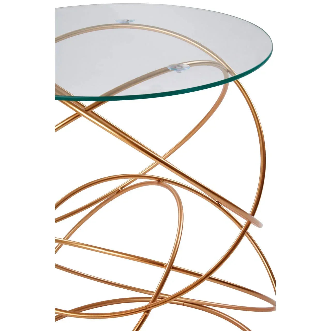 Round glass side table with gold metal swirl base, close-up angle