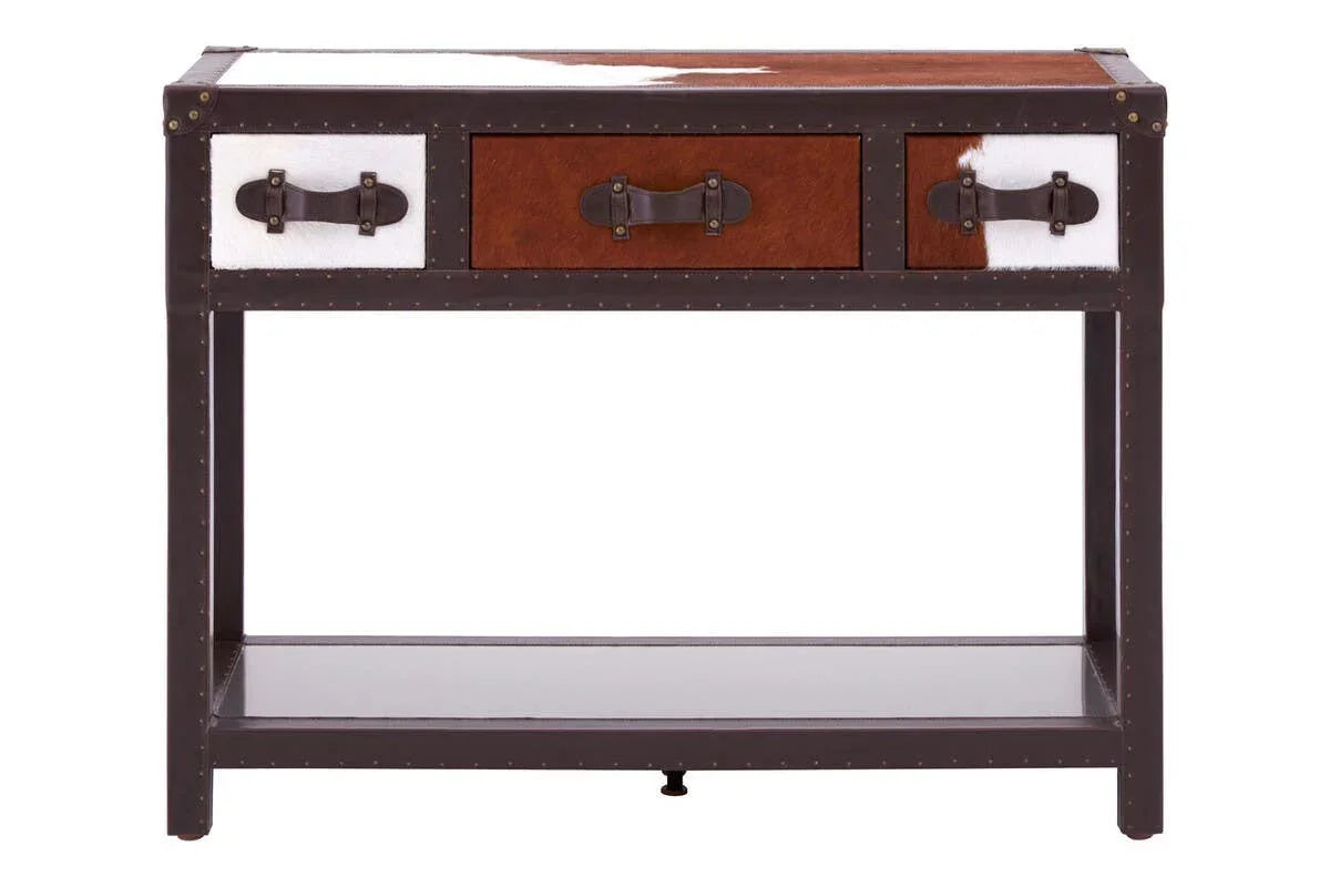 Brown and white cowhide console table with three drawers and lower shelf, front view