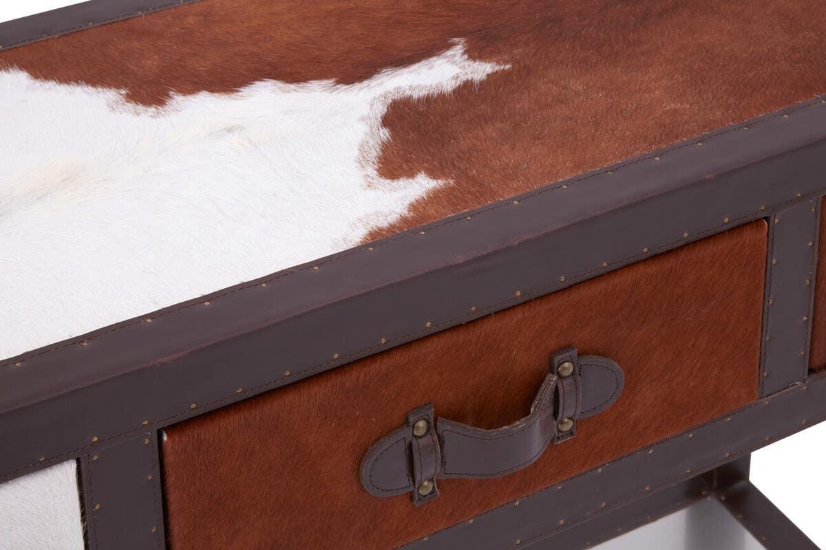 Brown and white cowhide drawer front with leather trim and metal handle detail