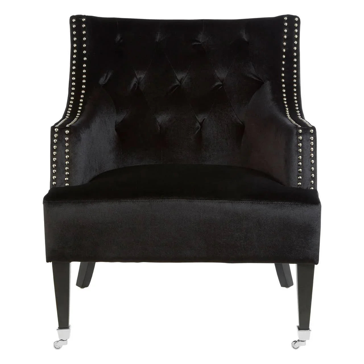 Black velvet accent chair with studded trim and tufted back on dark wood legs with casters