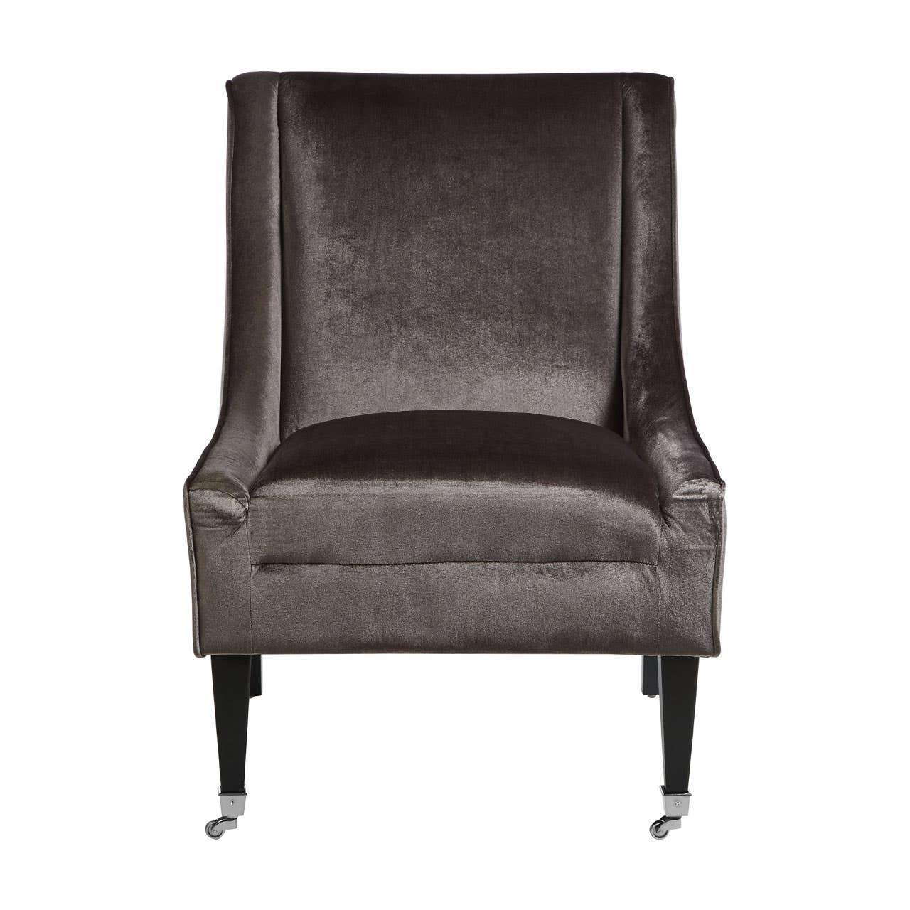Dark grey velvet armchair with high back, padded seat and castor wheels, front view
