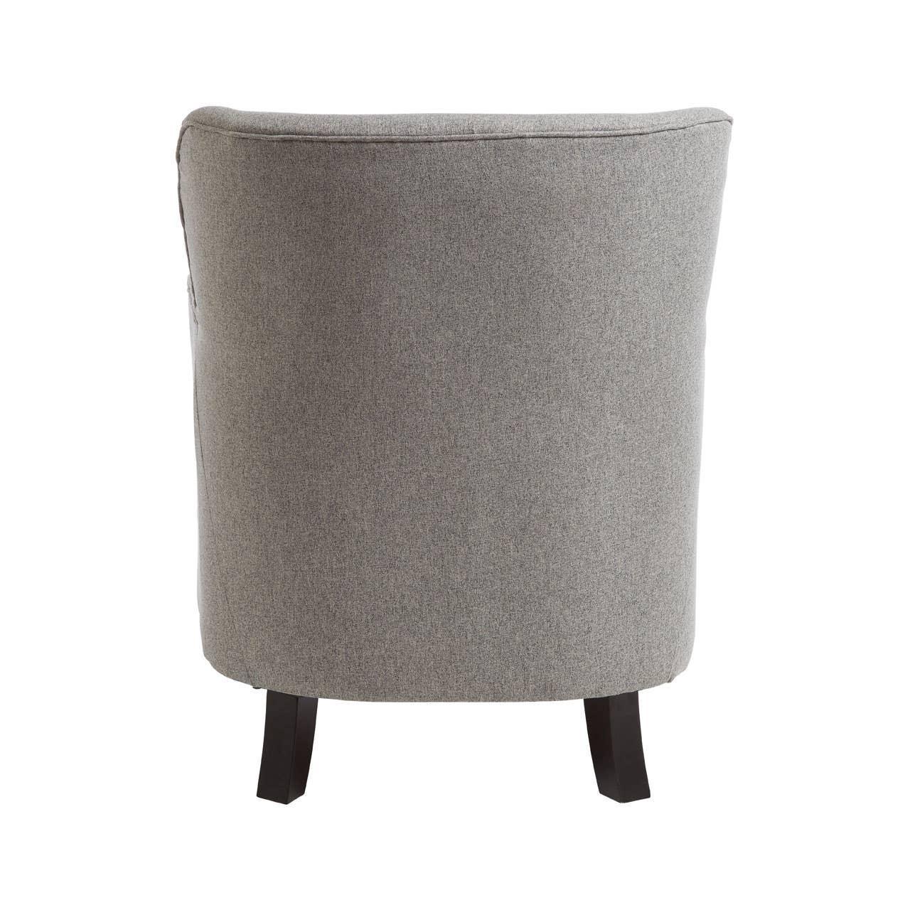 Back view of a grey fabric armchair with dark wooden legs