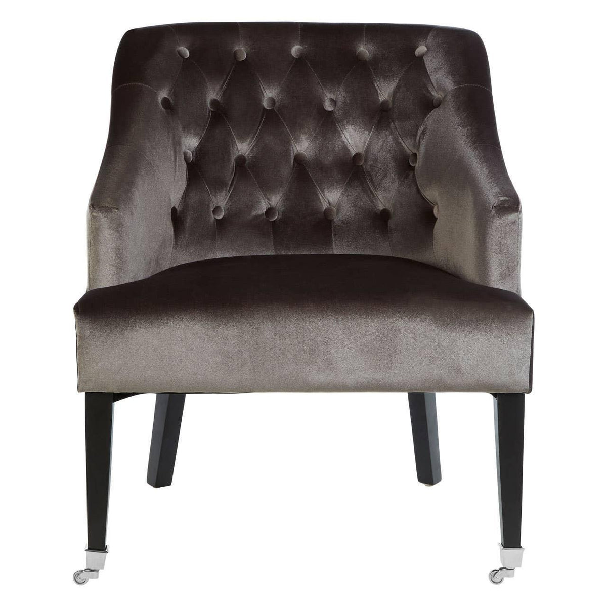 Tufted velvet armchair with dark wooden legs and front castor wheels, front view