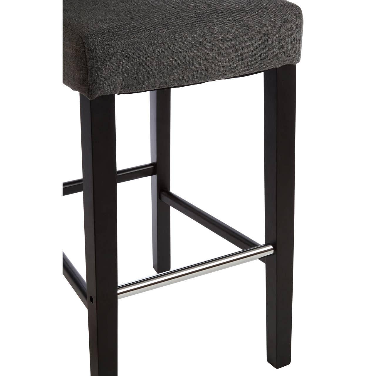 Dark wood bar stool base with chrome footrest and grey upholstered seat corner