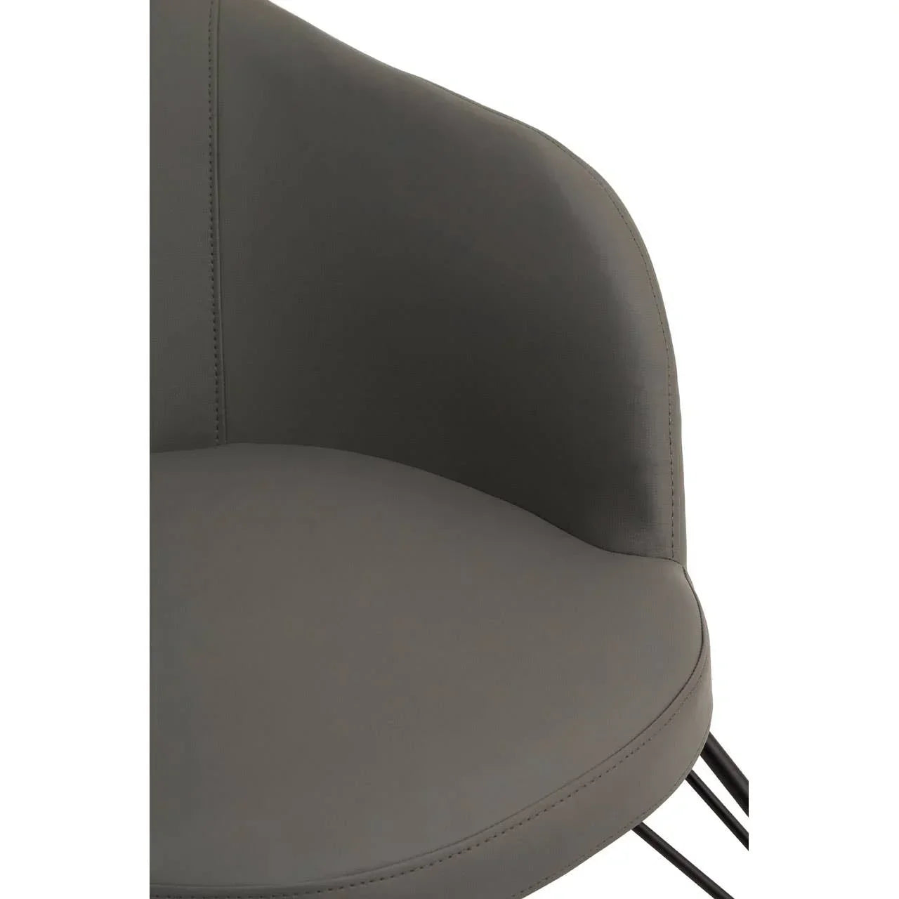 Grey faux leather dining chair with curved backrest and slim black metal legs close-up