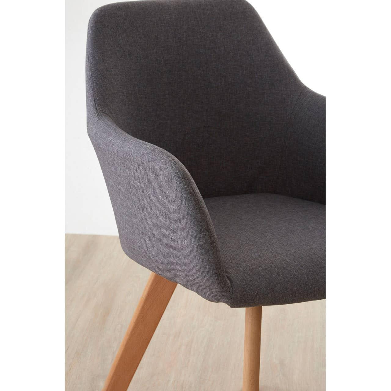Grey fabric dining chair with curved backrest and light wood legs on wood floor