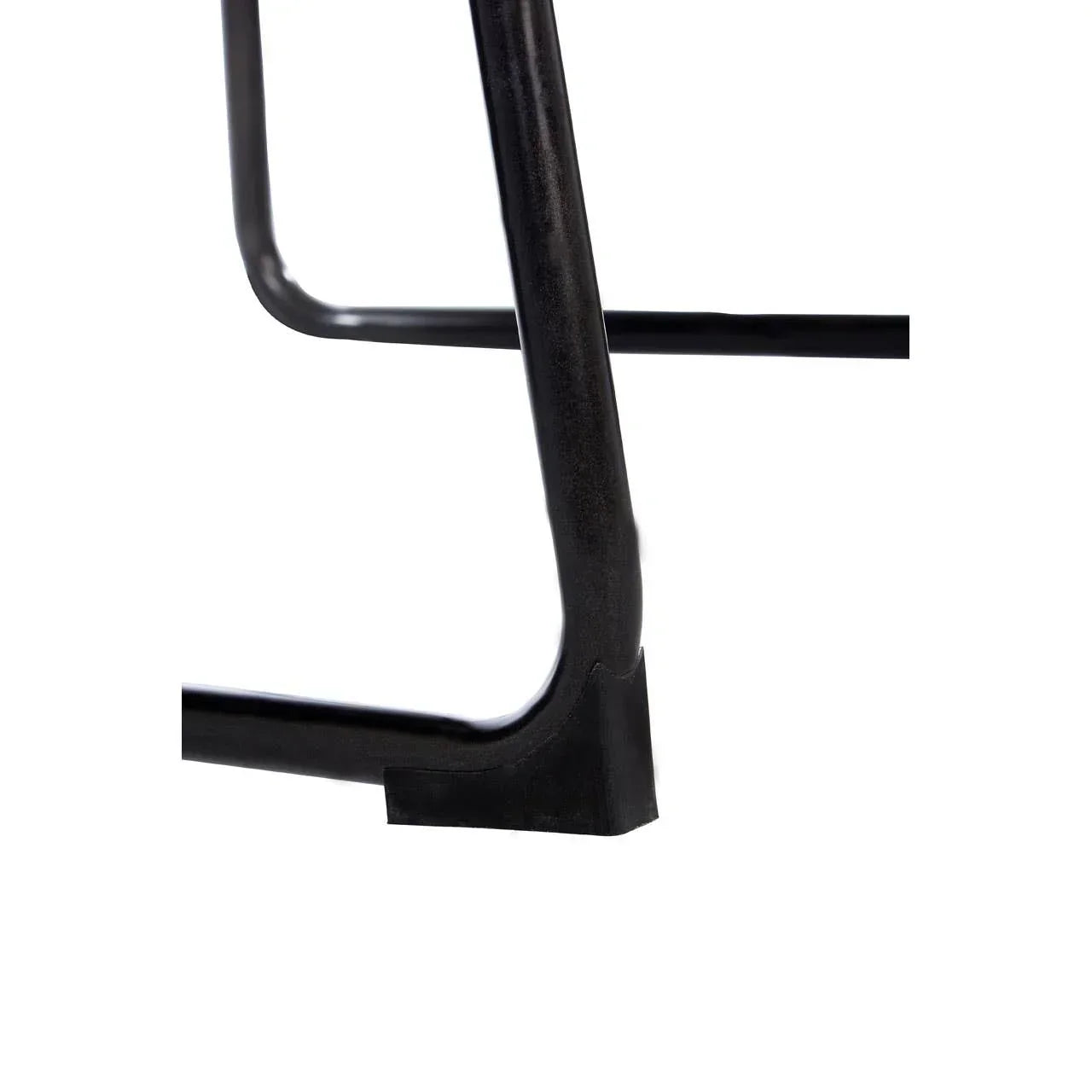Black metal furniture leg with protective floor cap, close-up view