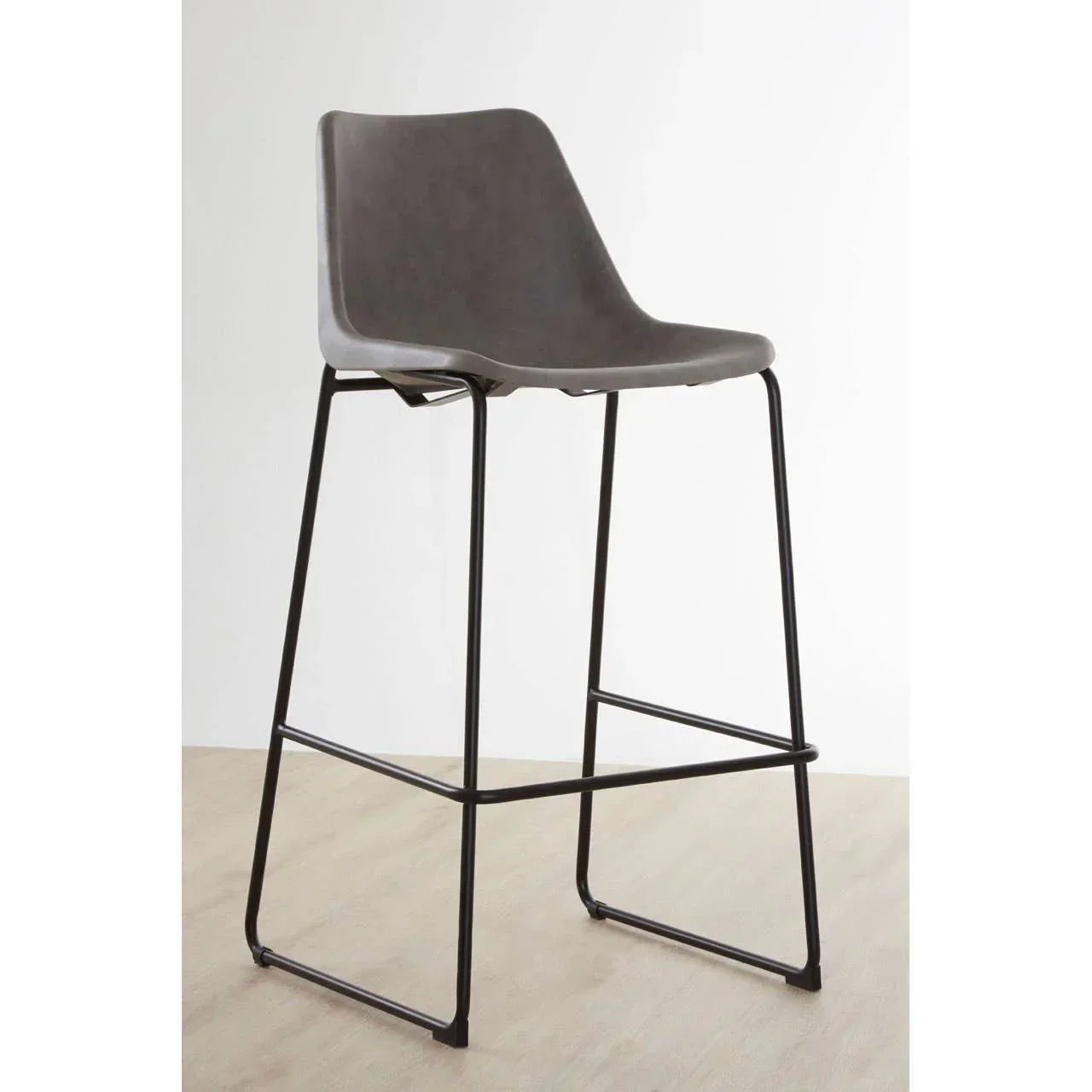 Grey bar stool with metal frame and contoured seat on wooden floor