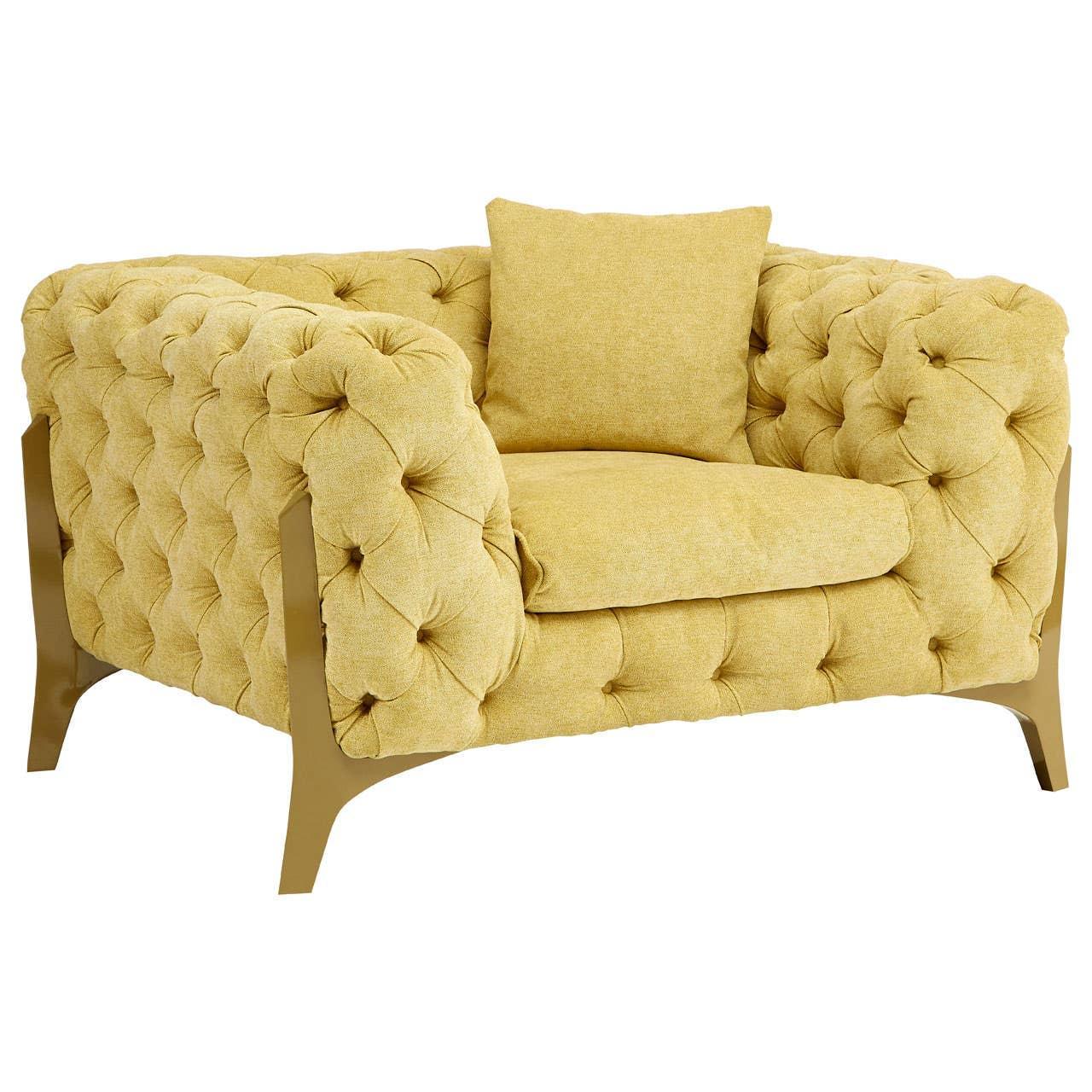 Mustard yellow tufted armchair with gold metal legs and matching cushion