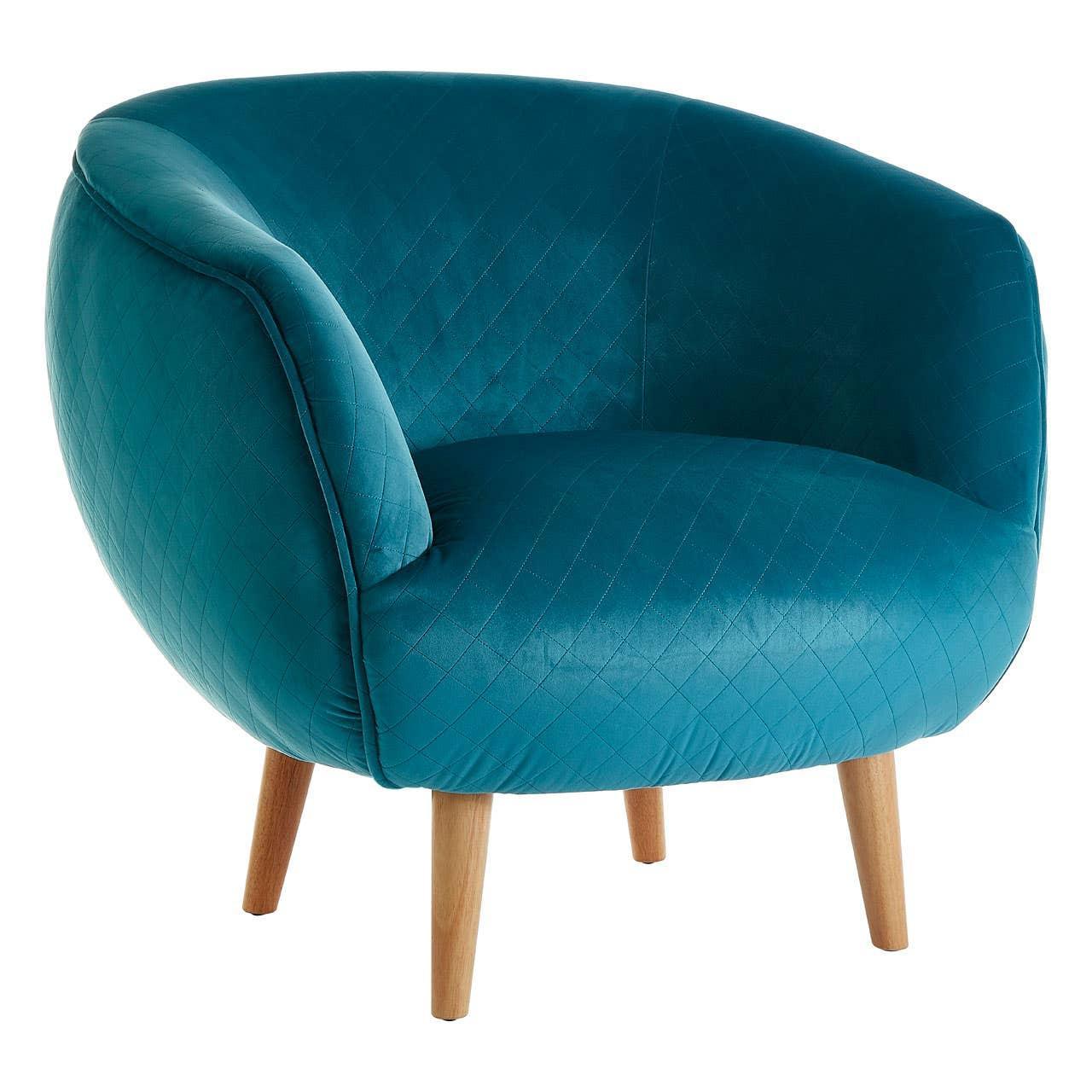 Teal velvet accent chair with quilted detailing and wooden legs, angled front view