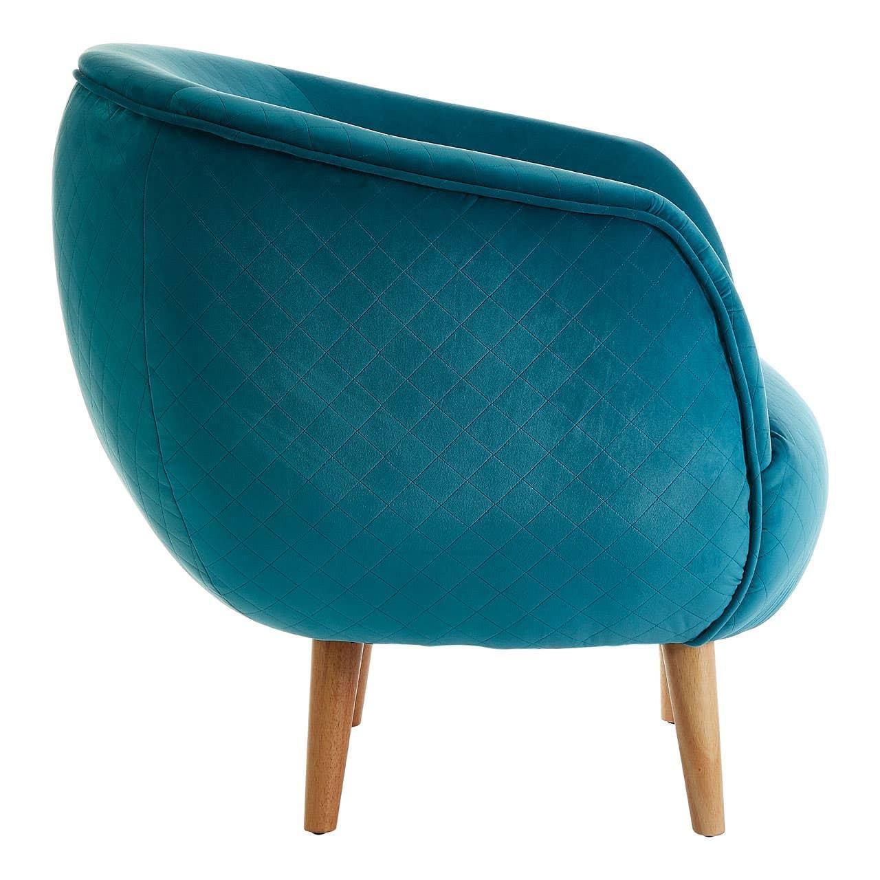 Teal accent armchair with quilted fabric and wooden legs, rear angled view