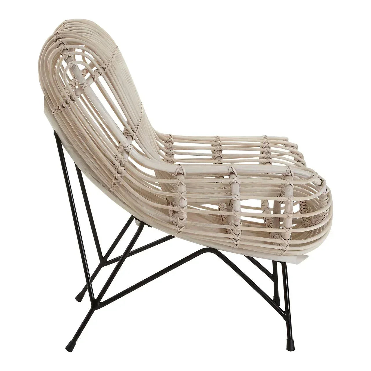 Natural rattan lounge chair with curved seat and black metal legs, side angle view