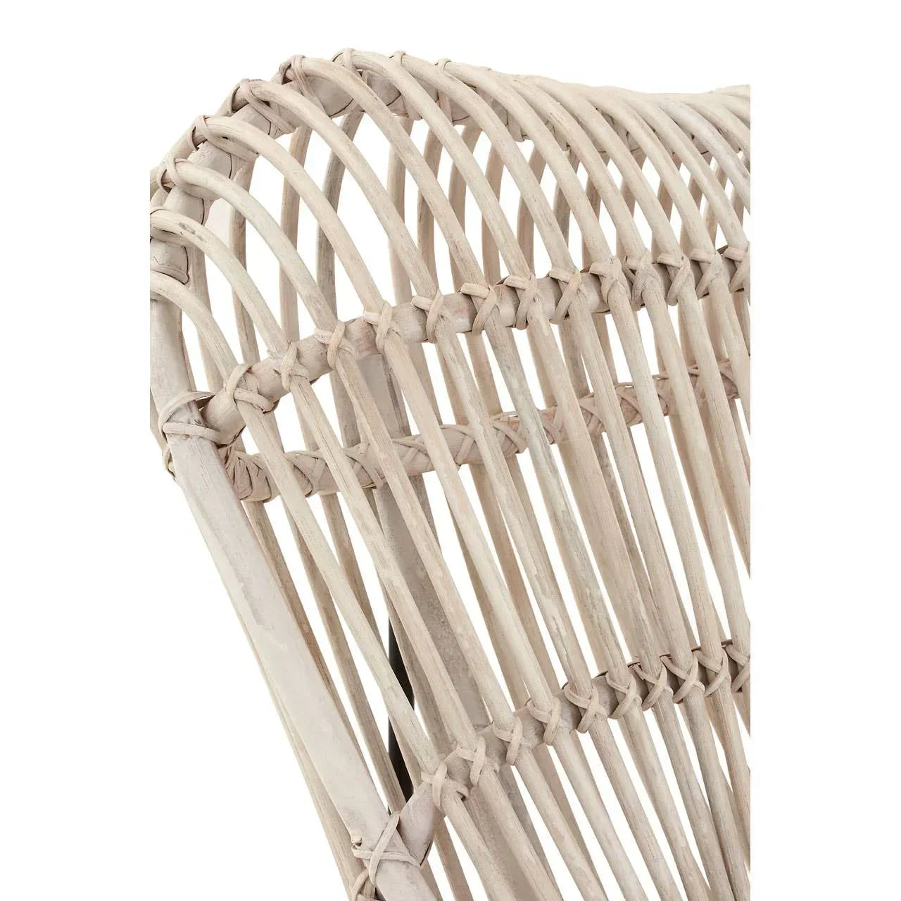 Closeup of natural rattan chair back with curved woven detail and light finish