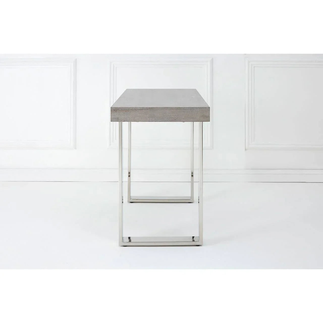 Side view of modern console table with grey wood top and chrome metal legs