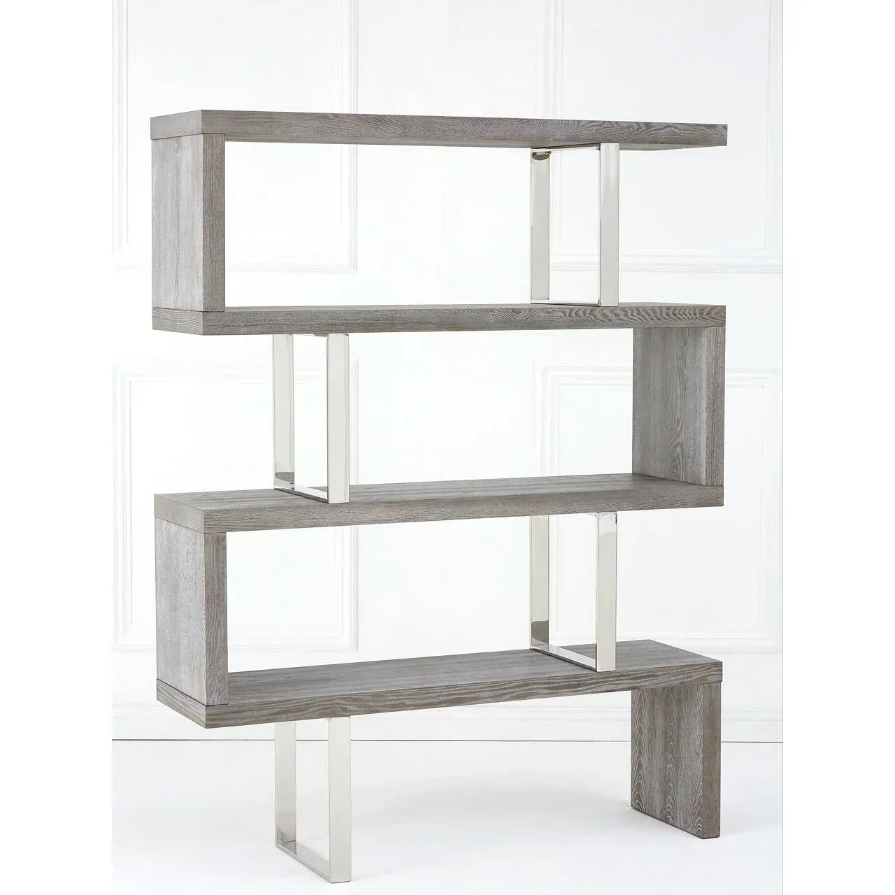 Modern wooden bookcase with open shelves and chrome supports against white wall