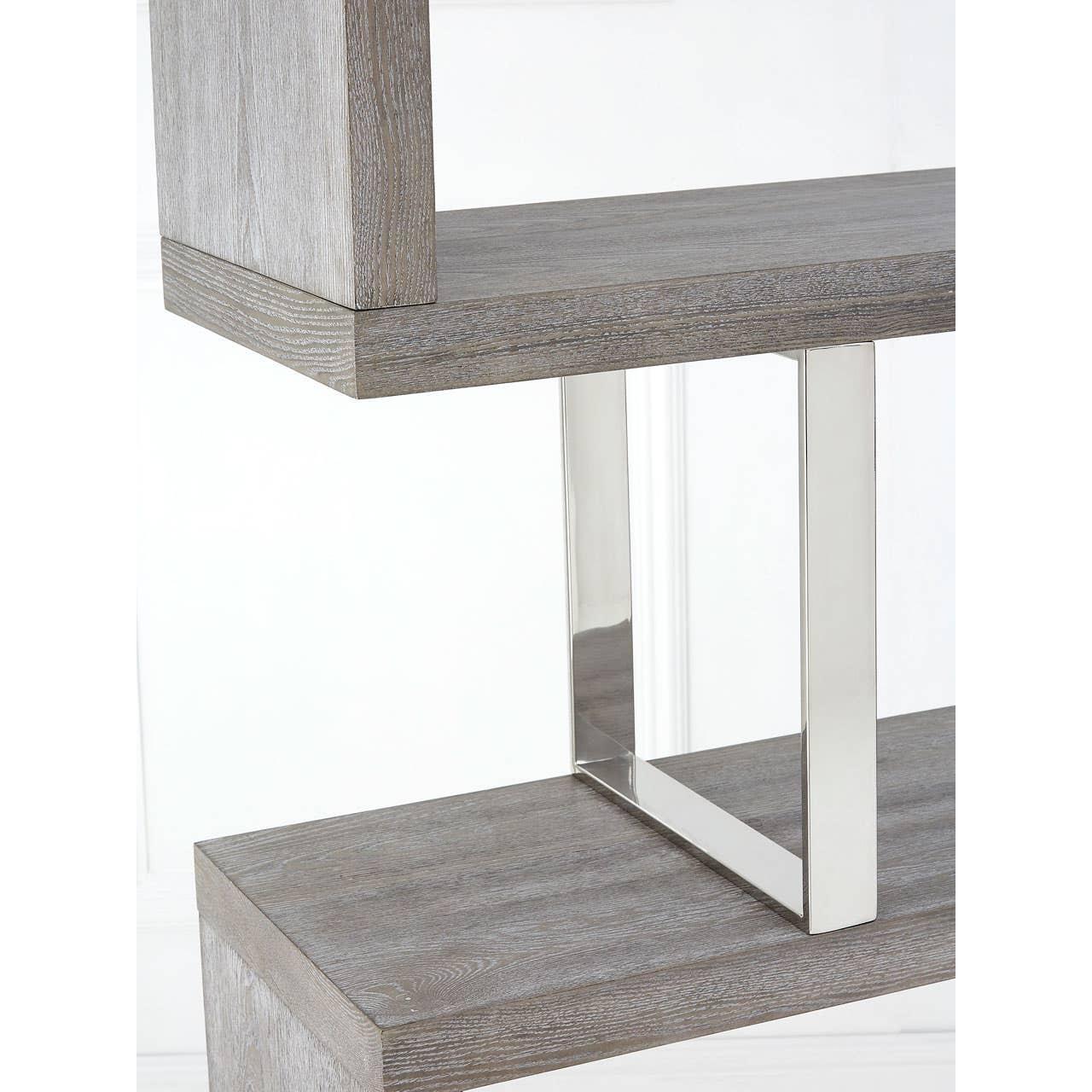 Grey wood shelving unit with chrome metal support detail, close-up view
