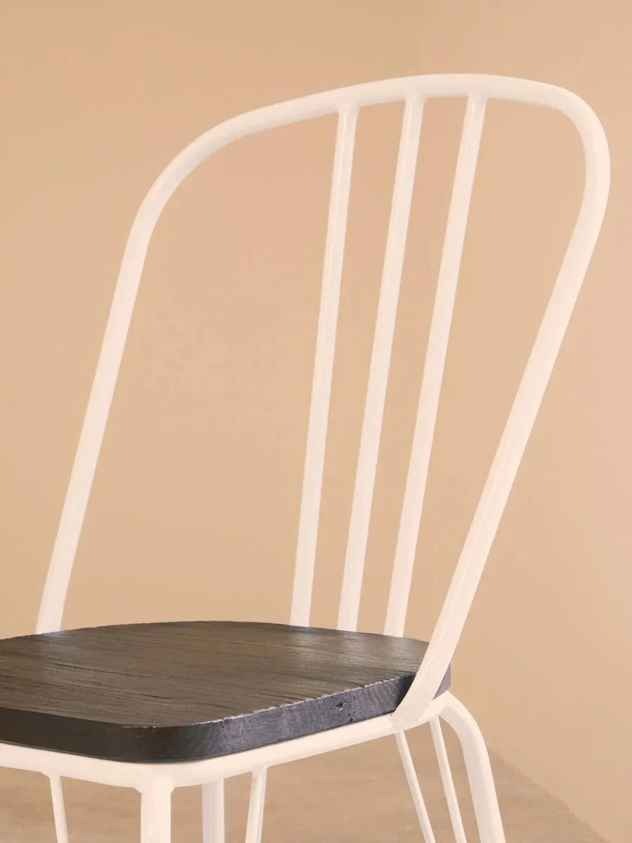 White metal dining chair with dark wooden seat, angled view against neutral background