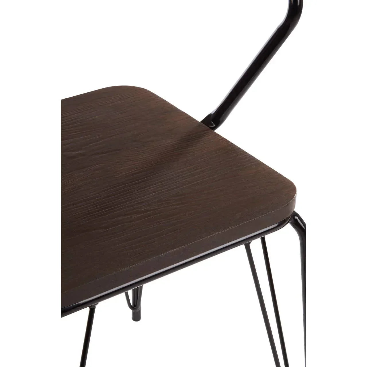 Closeup of dark wood dining chair seat with black metal legs and frame