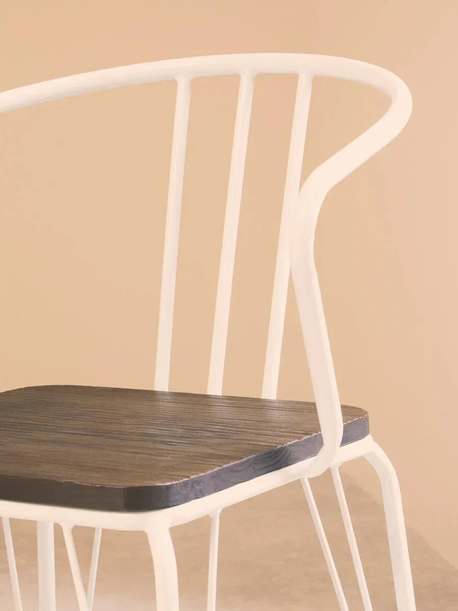 White metal chair with curved backrest and dark wood seat on beige background