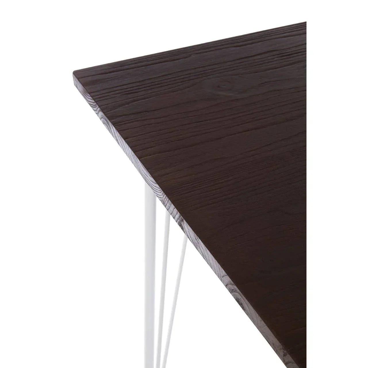 Dark wood dining table corner with white metal hairpin legs detail