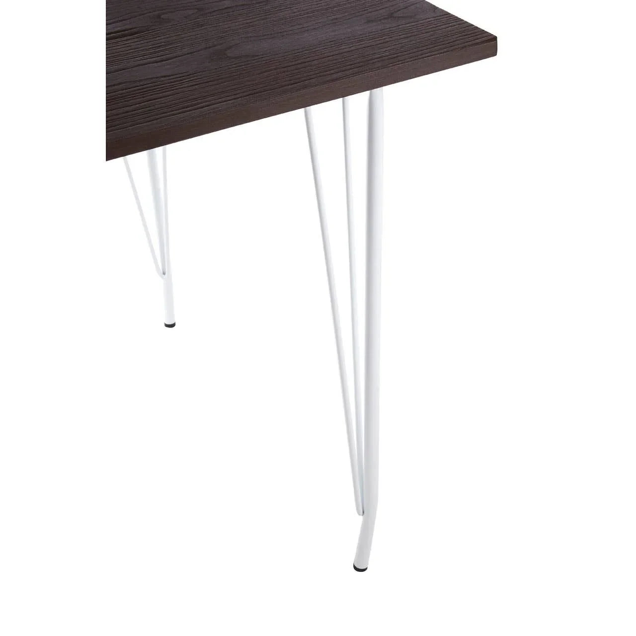 Dark wood dining table corner with white metal hairpin legs