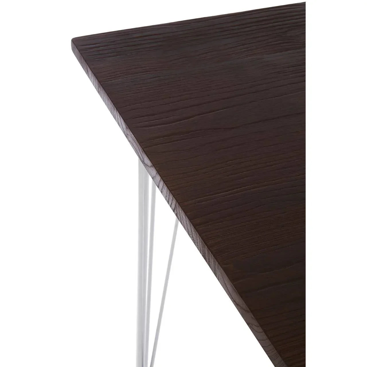 Dark wood dining table corner with white metal legs, close up on tabletop grain