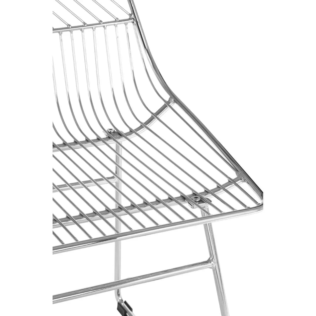 Close-up of chrome wire dining chair frame with angled seat and backrest