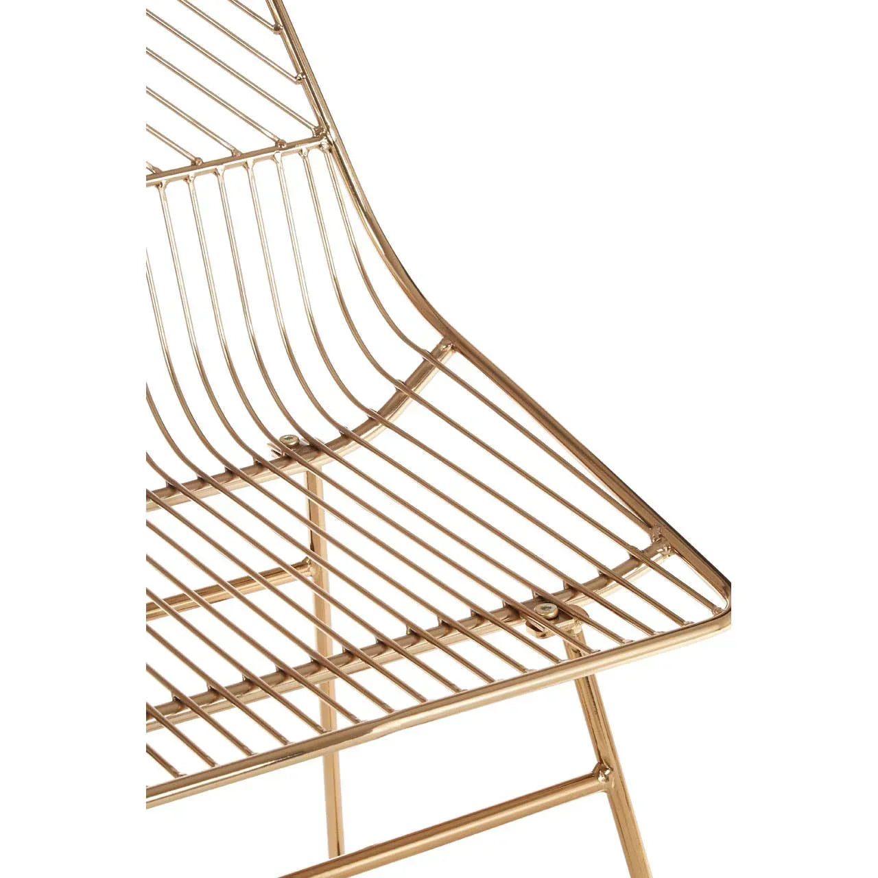 Gold metal dining chair frame with wire grid seat and angled lines closeup