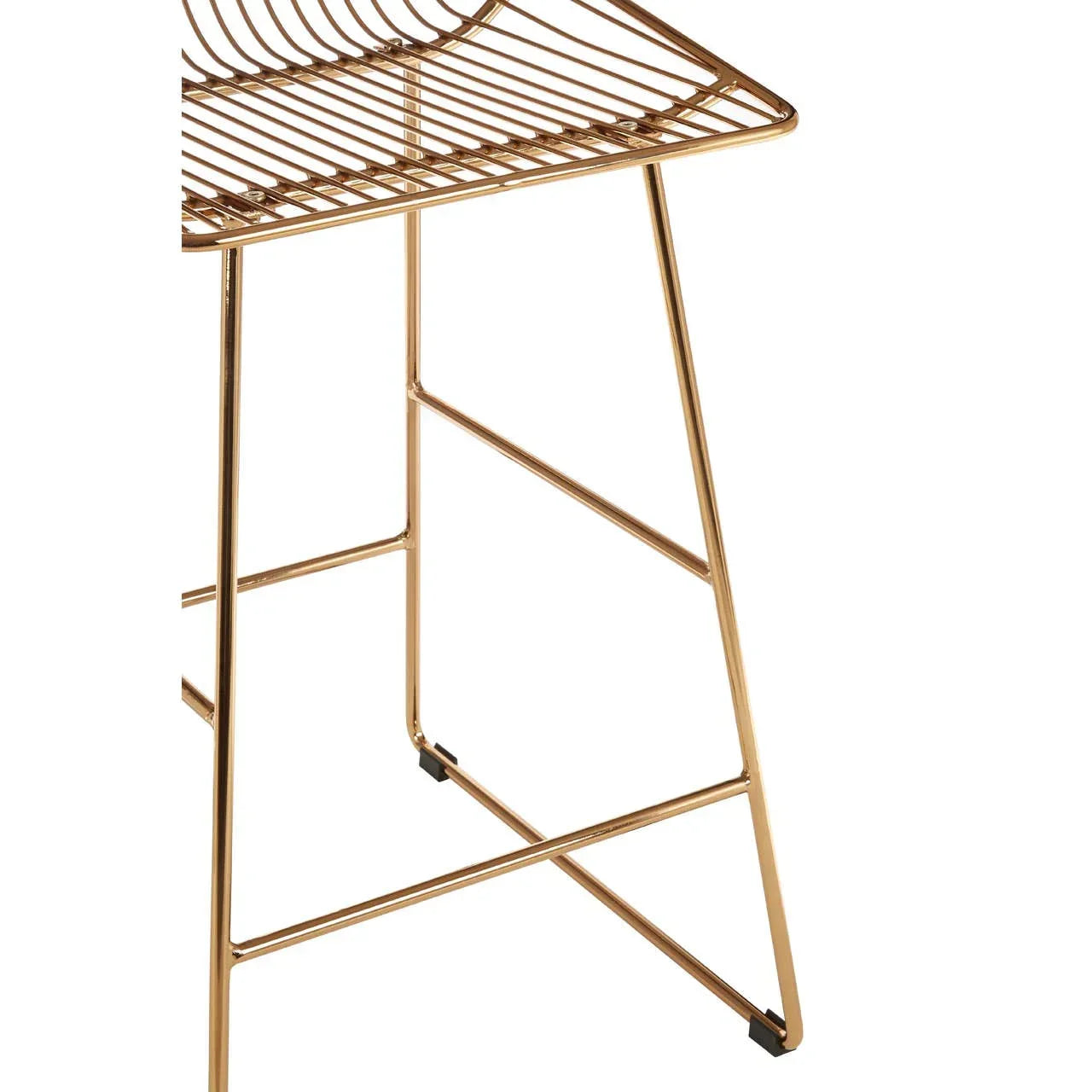 Gold metal bar stool with wire seat and angled legs, close-up of frame detail