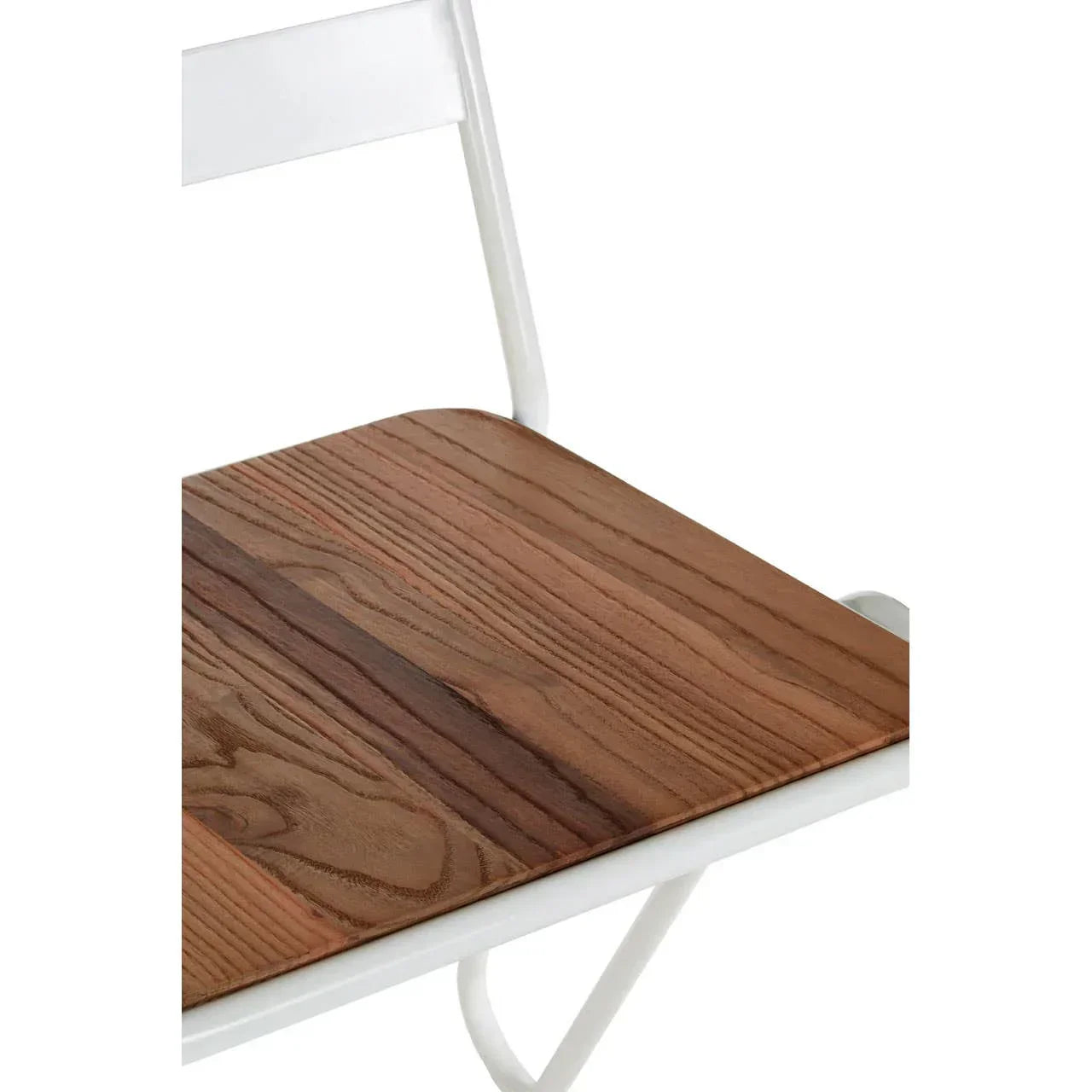 Closeup of wooden dining chair seat with white metal frame