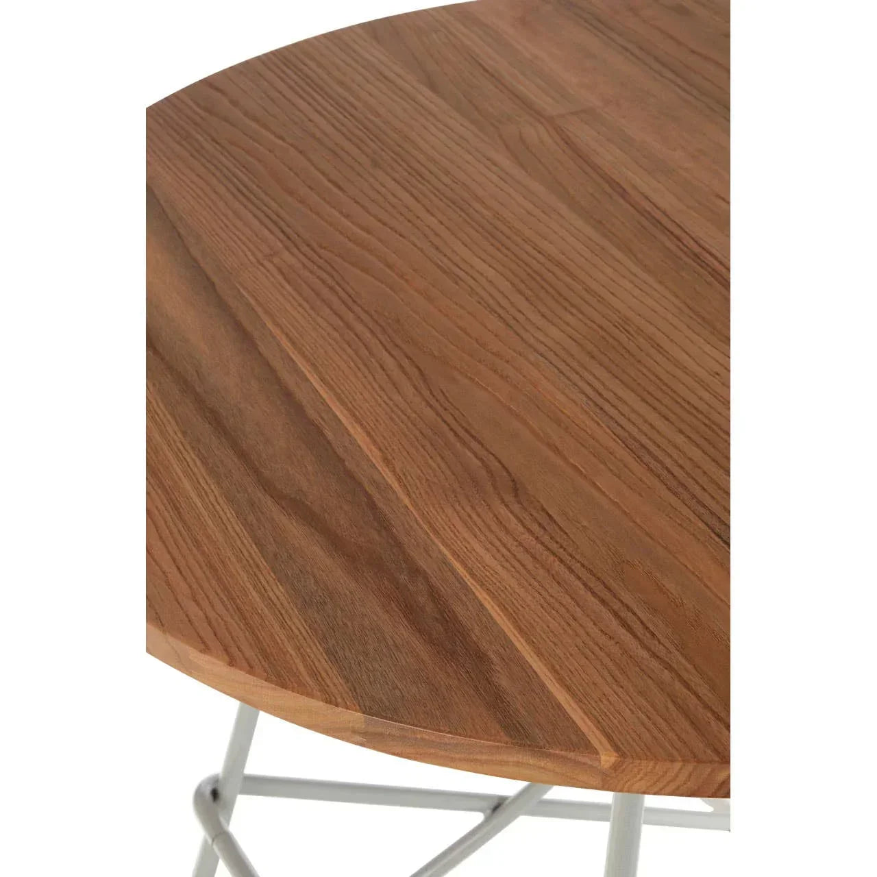 Closeup of round wooden dining table top with visible wood grain and metal legs