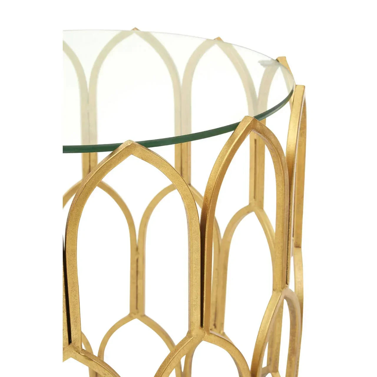 Round glass side table with gold metal frame and geometric arch pattern detail