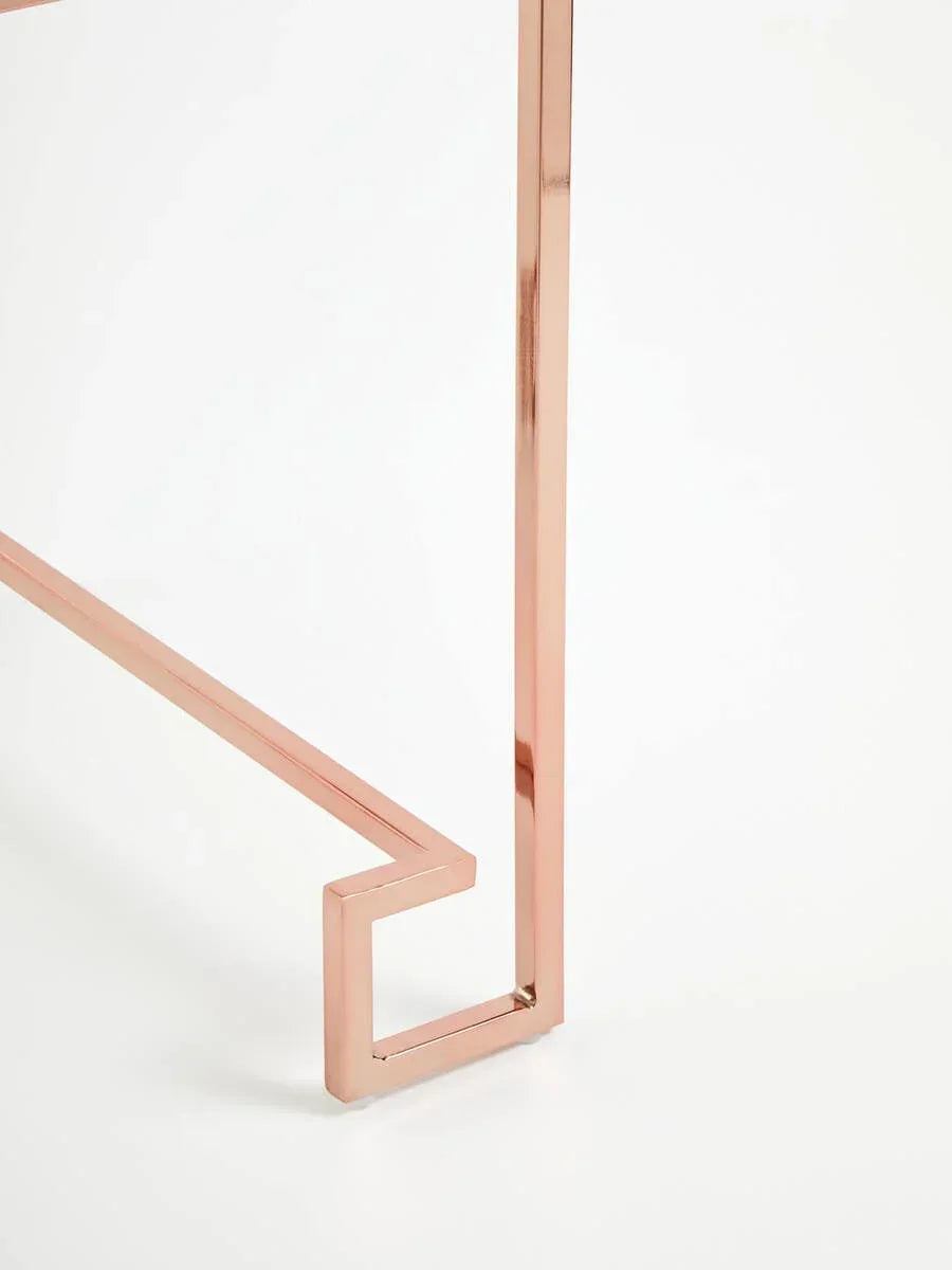 Rose gold metal table leg with geometric shape on white background