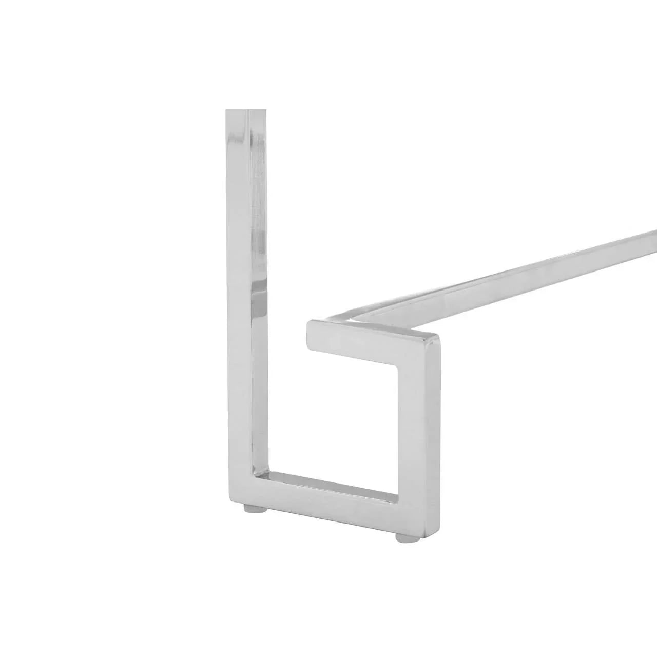 Close-up of a chrome metal table leg with geometric design