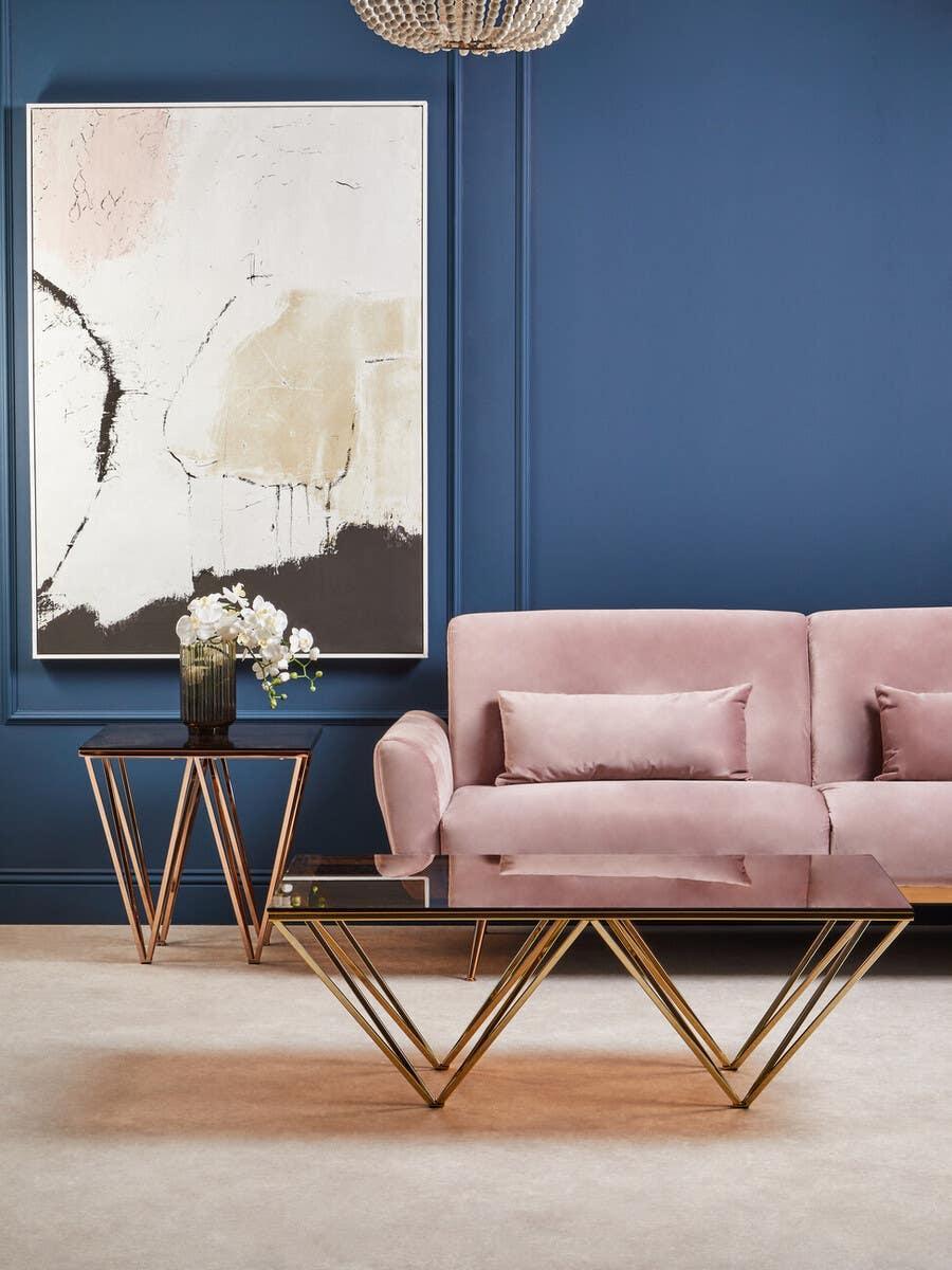 Velvet sofa with gold geometric coffee table and side table in modern living room