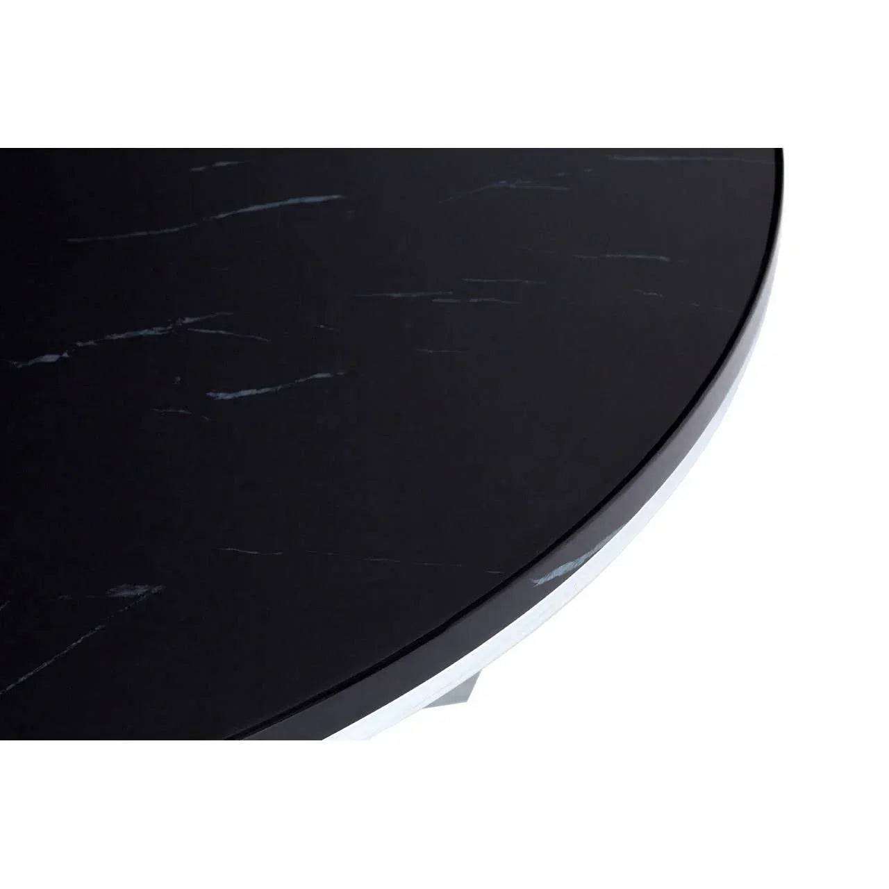 Close up of round black marble table top with subtle white veining detail