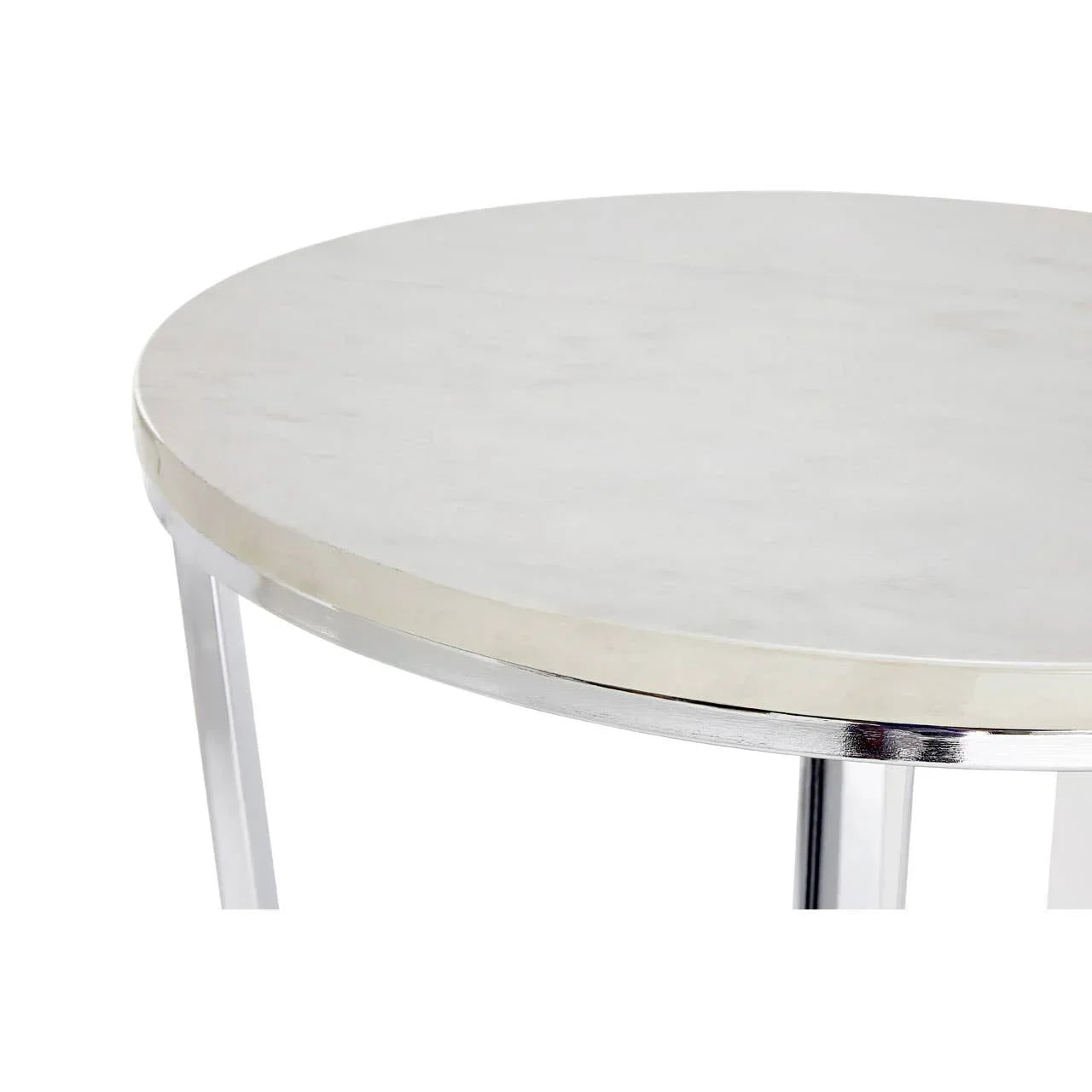 Round marble coffee table with chrome legs and a polished edge, close-up view