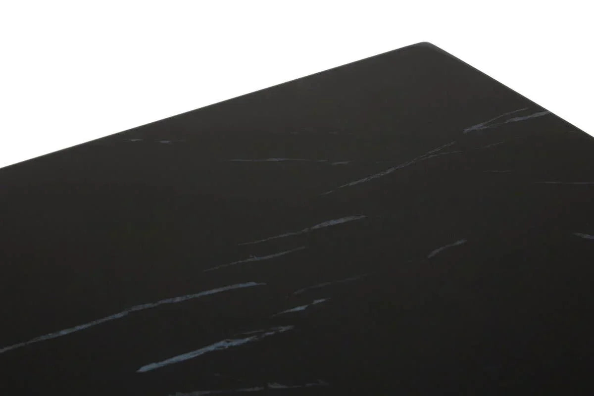 Black marble dining table top with subtle white veining detail close-up