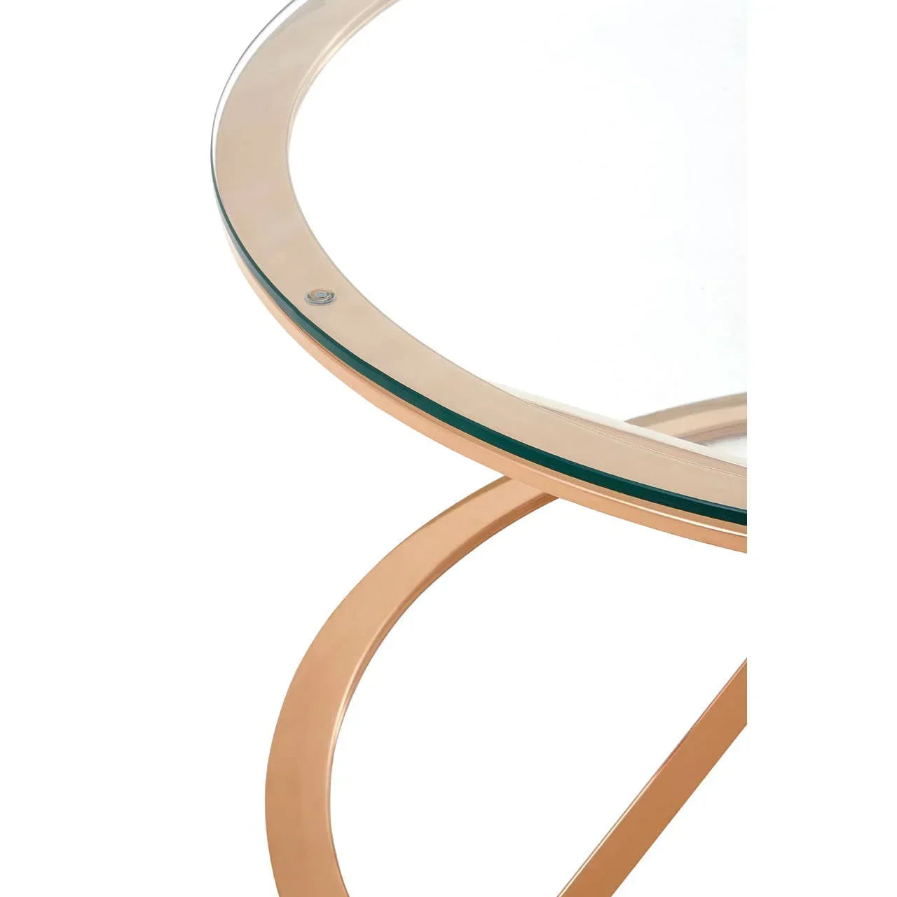Round glass coffee table with gold metal frame, closeup of tabletop and modern legs